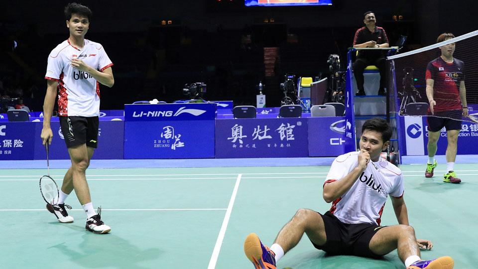 Ekspresi Angga/Ricky setelah meraih kemenangan melawan Korsel. - INDOSPORT