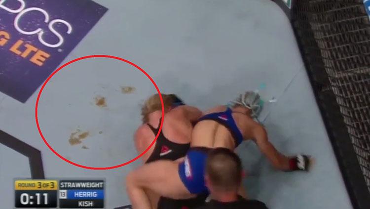 Noda kecokelatan yang terdapat dalam pertarungan Jusine Kish melawan Herrig. - INDOSPORT