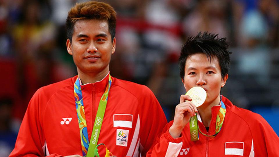 Tontowi Ahmad/Liliyana Natsir saat meraih emas di Olimpiade Rio 2016. - INDOSPORT