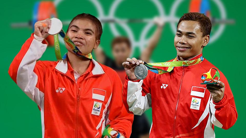 Atlet angkat besi, Sri Wahyuni (kiri) dan Eko Yuli Irawan peraih medali perak di Olimpiade 2016. Copyright: INDOSPORT/INTERNET
