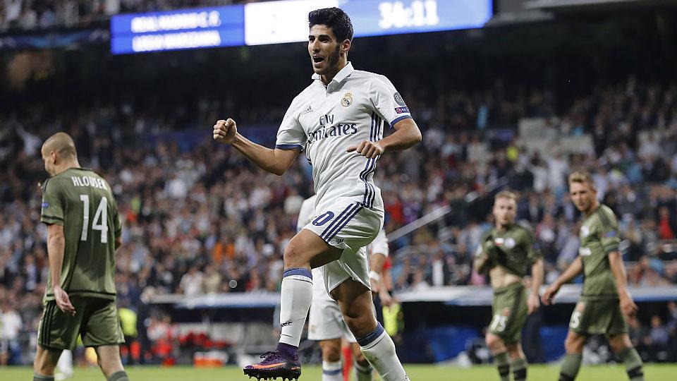 Marco Asensio melakukan selebrasi usai mencetak gol ke gawang Legia Warsawa. Copyright: internet