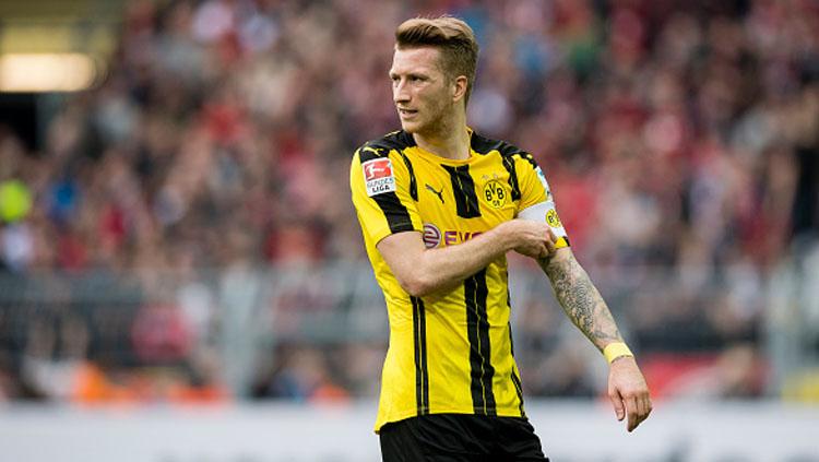 Marco Reus pada laga saat melawan Bayer Leverkusen. Copyright: Alexandre Simoes/Borussia Dortmund/Getty Images