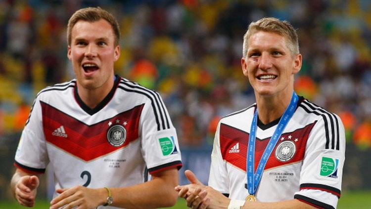 Kevin Grosskreutz dan Bastian Schweinsteiger saat juara Piala Dunia tahun 2014. - INDOSPORT