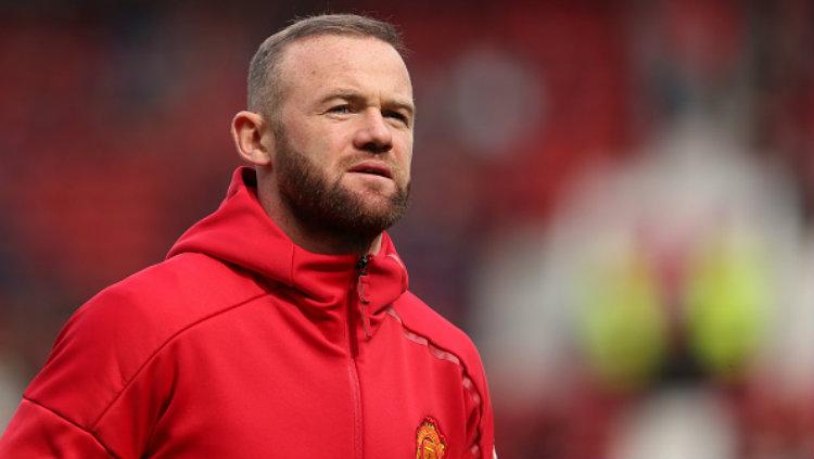 Kesibukan baru sebagai pelatih sepakbola di Amerika Serikat tidak membuat legenda Manchester United, Wayne Rooney, kehilangan atensi. - INDOSPORT