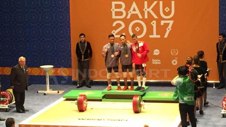 Cabang olahraga angkat besi Indonesia berhasil meraih tiga medali emas dalam ajang Islamic Solidarity Games 2017. - INDOSPORT