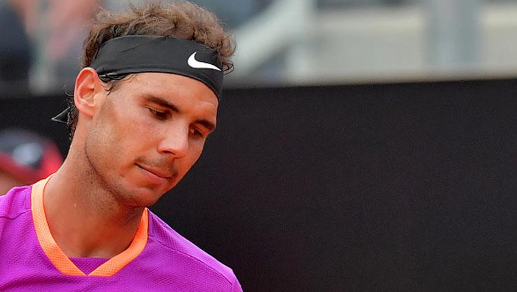 Rafael Nadal tengah berlaga di turnamen tenis Madrid Terbuka 2019. Tiziana Fabi via Getty Images. - INDOSPORT