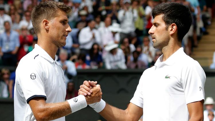 Martin Klizan dan Novak Djokovic. Copyright: Twitter/@BasiaID