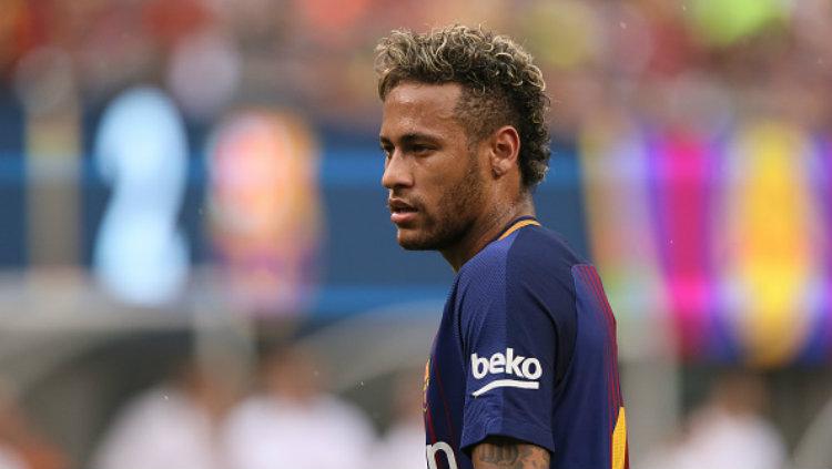 Bintang Barcelona, Neymar diisukan untuk hengkang ke PSG. Copyright: Matthew Ashton - AMA/Getty Images