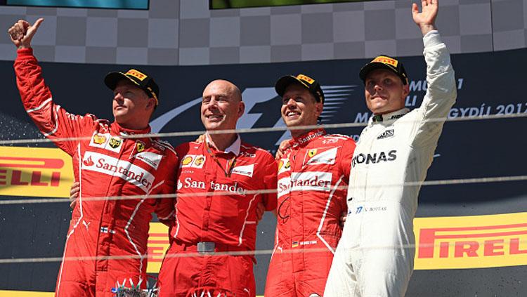Sebastian Vettel berhasil finish diurutan pertama posisi kedua diisi oleh rekan setimnya Kimi Raikkonen dan Valtteri Bottas di posisi ketiga. Copyright: INDOSPORT