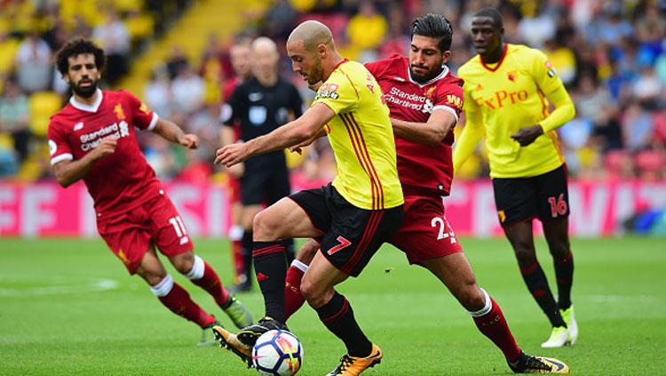 Nordin Amrabat mendapat kawalan ketat dari Emre Can. Copyright: INDOSPORT