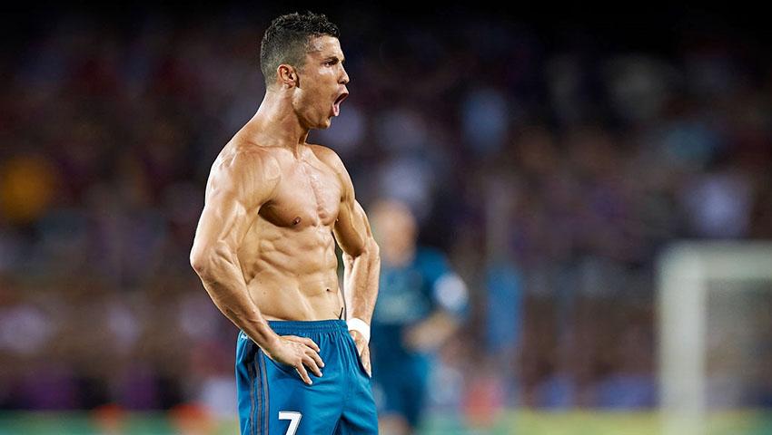 Selebrasi Cristiano Ronaldo (Real Madrid) saat mencetak gol ke gawang Barcelona. Copyright: Indosport.com