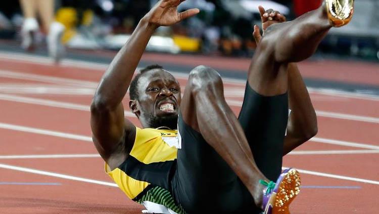 Usain Bolt terjatuh saat ikut Kejuaraan Dunia Atletik 2017. Copyright: INDOSPORT