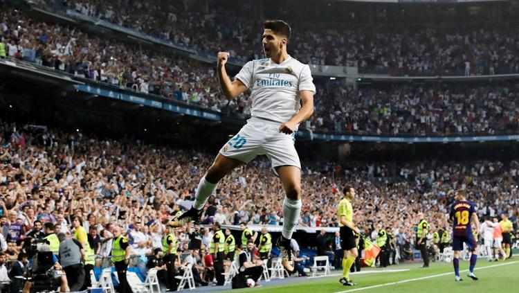 Selebrasi Asensio usai cetak gol ke gawang Barcelona. Copyright: Getty Images