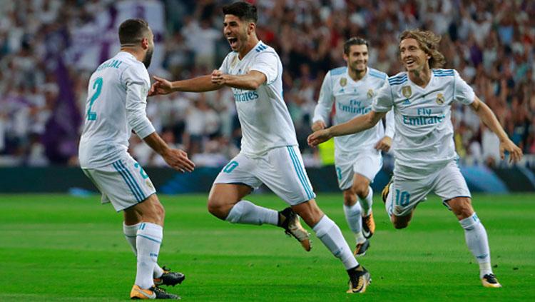 Selebrasi Marco Asensio saat membuka keunggulan Real Madrid atas Barcelona. Copyright: INDOSPORT