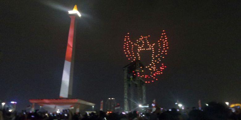 Pertunjukan light show dari 300 drone menampilkan lambang Garuda. Copyright: Kompas.com