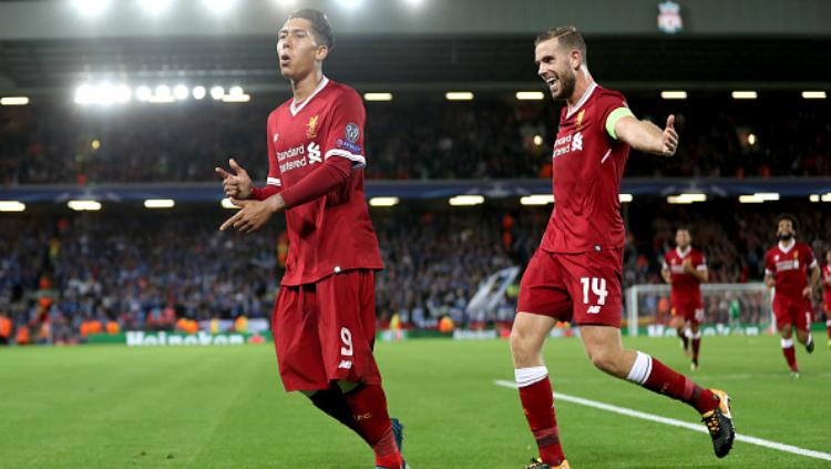 Roberto Firmino melakukan selebrasi setelah mencetak gol. Copyright: Indosport