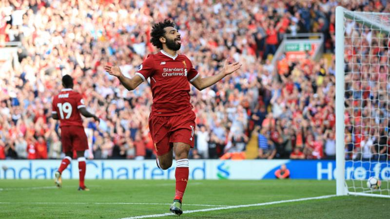Mohamed Salah merayakan gol ketiga untuk Liverpool. Copyright: INDOSPORT