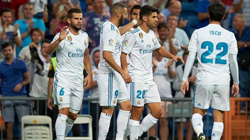 Marco%20Asensio%20merayakan%20golnya%20yang%20pertama%20bersama%20rekan-rekannya.