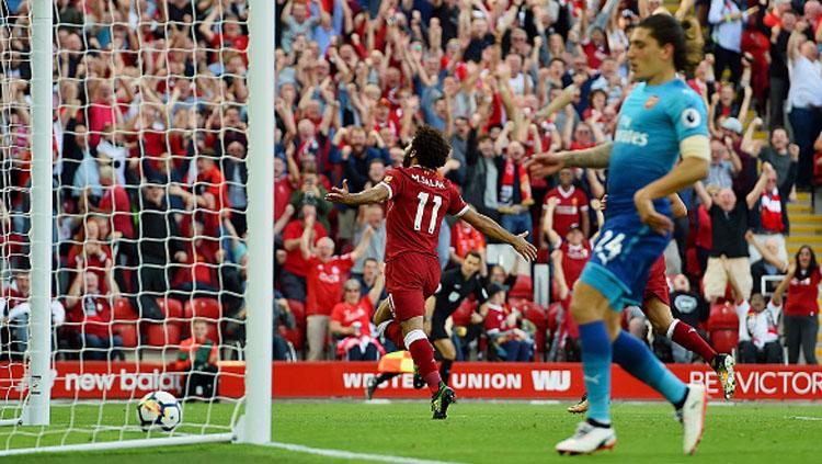 Selebrasi Mohamed Salah usai cetak gol ke gawang Arsenal.