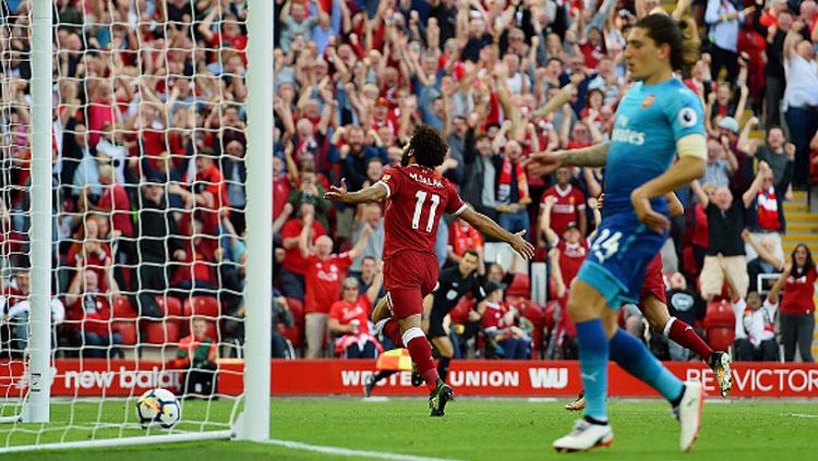 Selebrasi Mohamed Salah usai cetak gol ke gawang Arsenal. Copyright: INDOSPORT