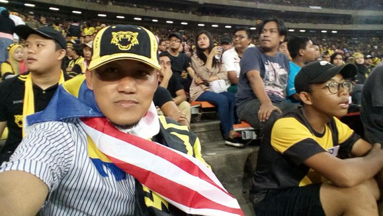 Andri Suwarno pendukung Timnas Indonesia yang menyamar jadi suporter Malaysia Copyright: facebook/Andri.Suwarno