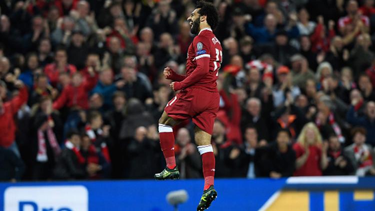 Selebrasi pemain bintang Lvierpool, Mohamed Salah usai cetak gol ke gawang Sevilla. Copyright: INDOSPORT