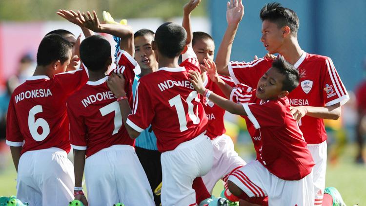 Sepakbola Indonesia Danone Nations Cup lolos ke babak 16 besar.