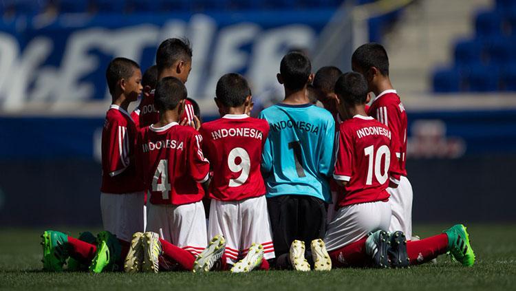 Para pemain Timnas Indonesia U-12 bersyukur setelah menempati peringkat delapan di ajang Piala Dunia U-12 2018. Copyright: @danonenationcup