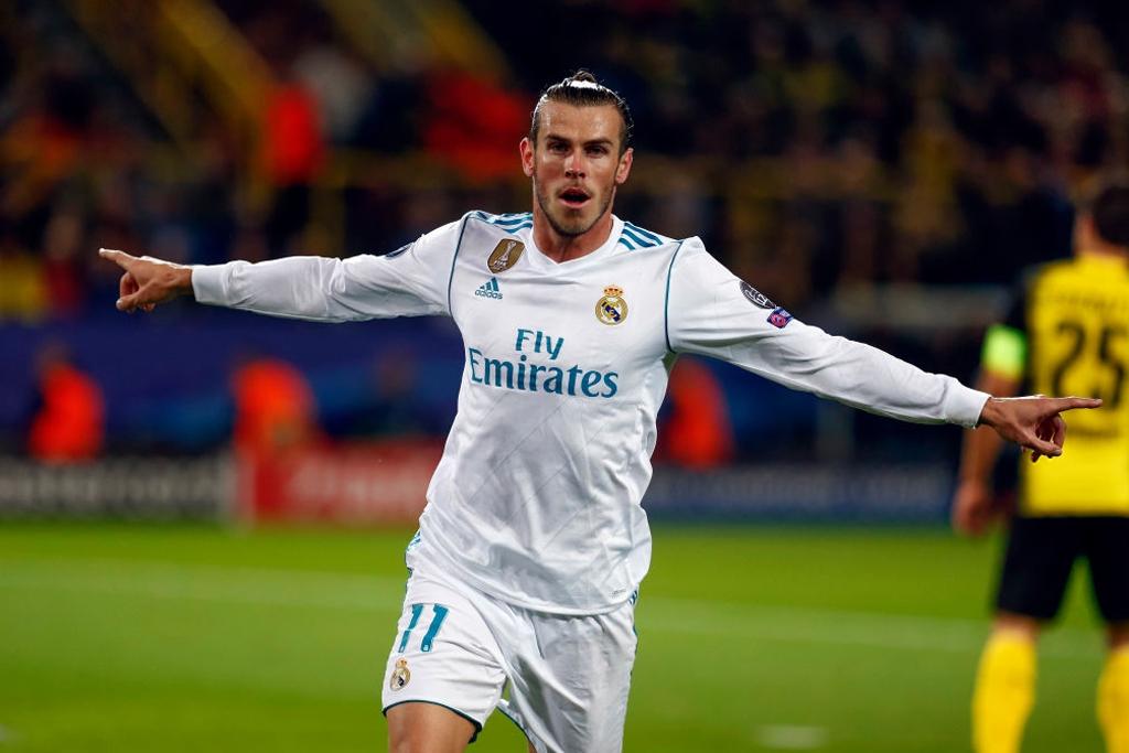 Gareth Bale merayakan gol pada pertandingan Grup H Liga Champions melawan Borussia Dortmund di Signal Iduna Park.