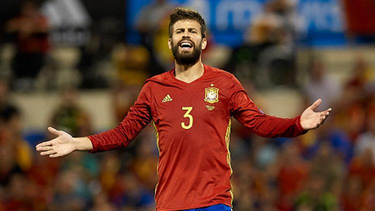 Gerard Pique kala memperkuat Timnas Spanyol. Copyright: INDOSPORT