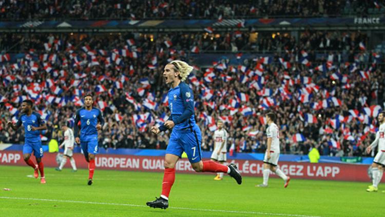 Antoine Griezmann berselebrasi usai cetak gol untuk Timnas Prancis. Copyright: INDOSPORT