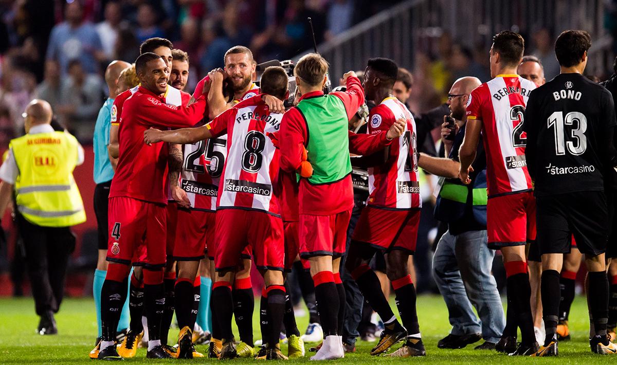 Selebrasi para pemain Girona usai membekuk Real Madrid dengan skor 2-1.