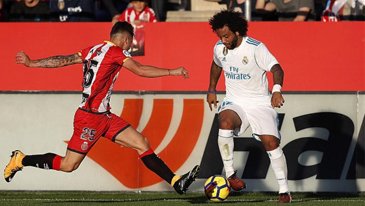 Marcelo saat berjibaku dengan pemain Girona. Copyright: INDOSPORT