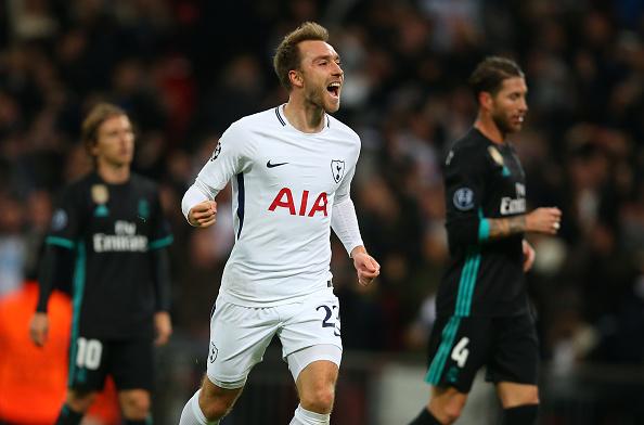 Christian Eriksen merayakn golnya ke gawang Real Madrid. Copyright: INDOSPORT