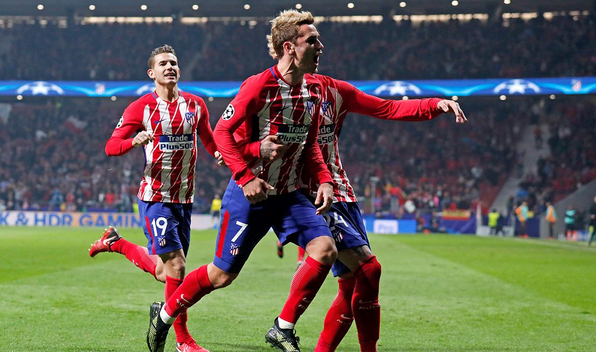 Antoine Griezmann melakukan selebrasi bersama rekan satu timnya. Copyright: INDOSPORT