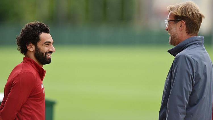 Jurgen Klopp dan Mohamed Salah. Copyright: INDOSPORT