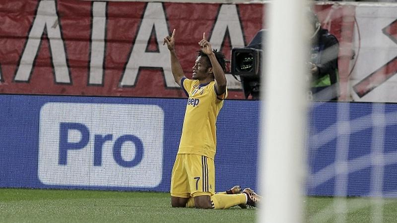 Juan Cuadrado merayakan gol yang ia cetak. - INDOSPORT
