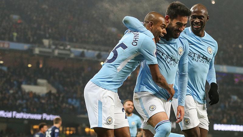 Gundogan merayakan golnya ke gawang Tottenham Hotspur. Copyright: INDOSPORT