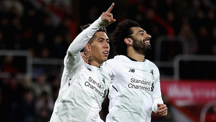 Roberto Firmino dan Mohamed Salah tengah melakukan selebrasi. Copyright: INDOSPORT