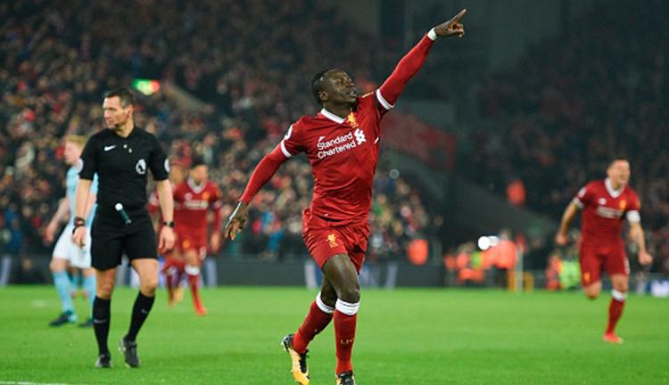 Sadio Mane melakukan selebrasi usai berhasil mencetak gol ke gawang Manchester City. Copyright: INDOSPORT