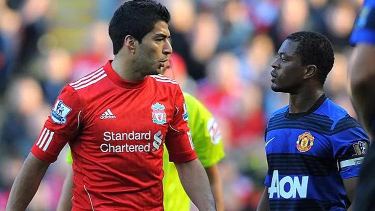 Luis Suarez dan Patrice Evra. Copyright: INDOSPORT