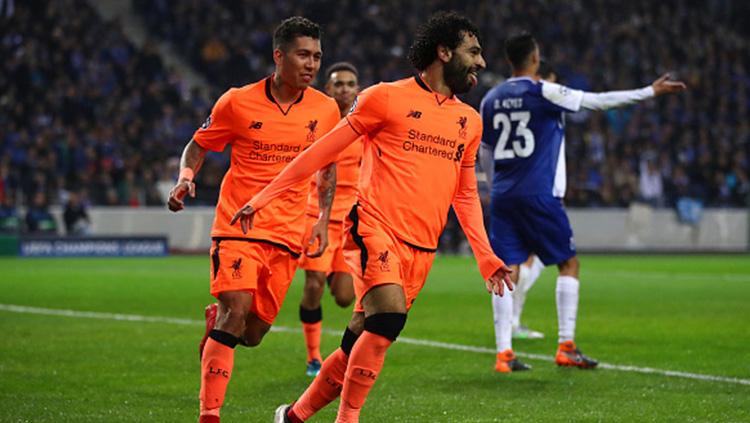 Mohamed Salah berselebrasi usai membobol gawang FC Porto di babak 16 besar Liga Champions. Copyright: INDOSPORT