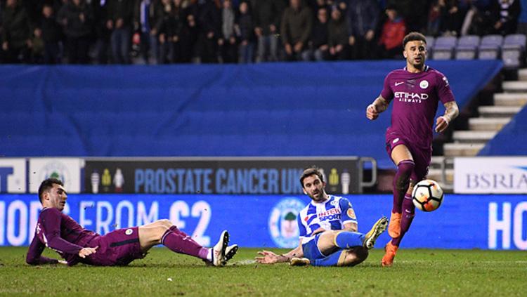 Momen gol Wigan ke gawang Manchester City diciptakan oleh, William Grigg. Copyright: INDOSPORT