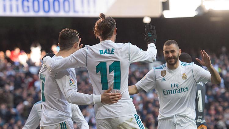Cristiano Ronaldo dan Karim Benzema merayakan gol Gareth Bale.
