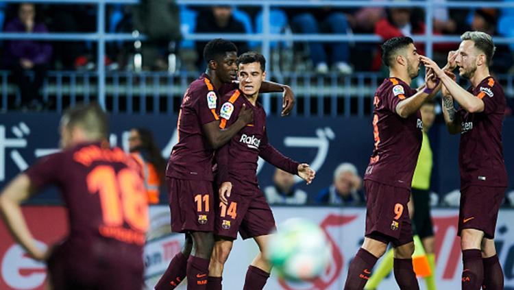 Philpe Coutinho merayakan gol yang turut dicetaknya ke gawang Malaga. - INDOSPORT