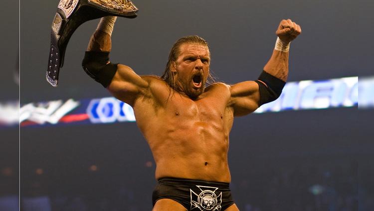 Triple H menjadi salah satu pegulat terbaik WWE yang pernah memegang sabuk juara kelas berat. - INDOSPORT
