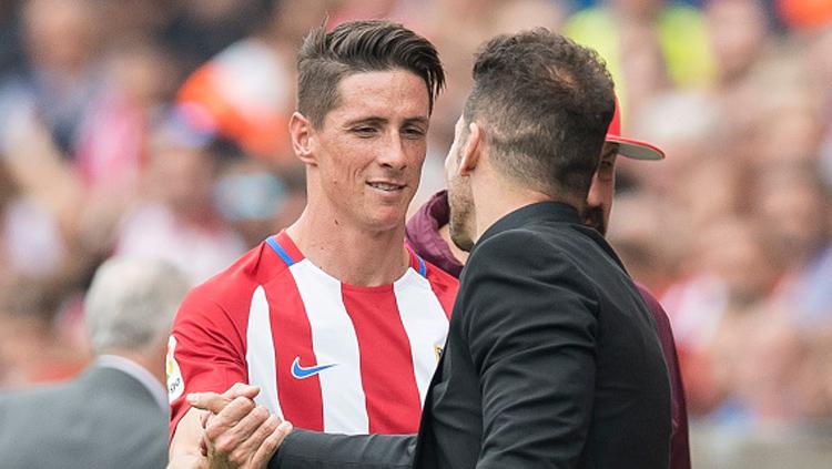 Striker dan pelatih Atletico Madrid, Fernando Torres (kiri) dan Diego Simeone. Copyright: Getty Images