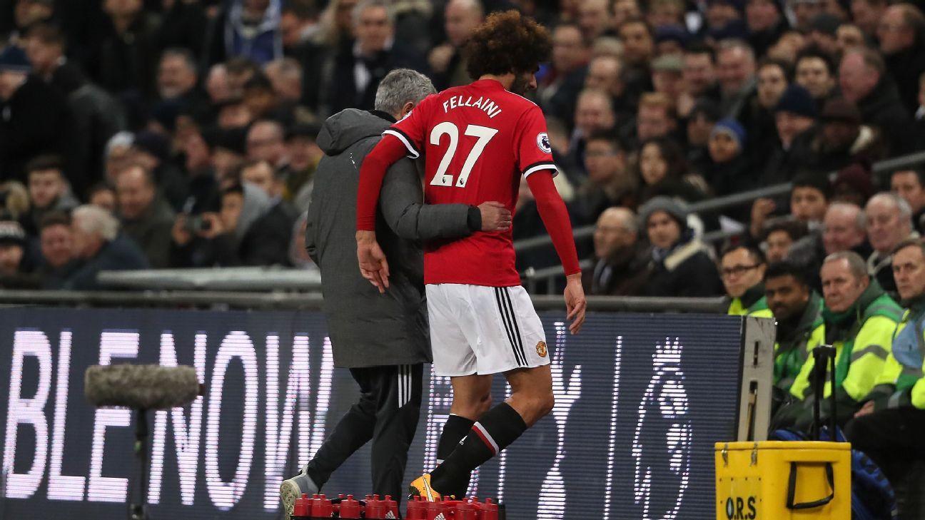 Marouane Fellaini dan Jose Mourinho. - INDOSPORT