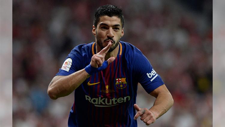 Luiz Suarez saat merayakan gol.