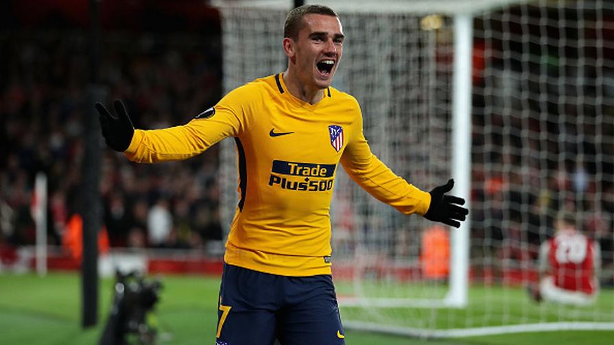 Antoine Griezmann merayakan golnya.